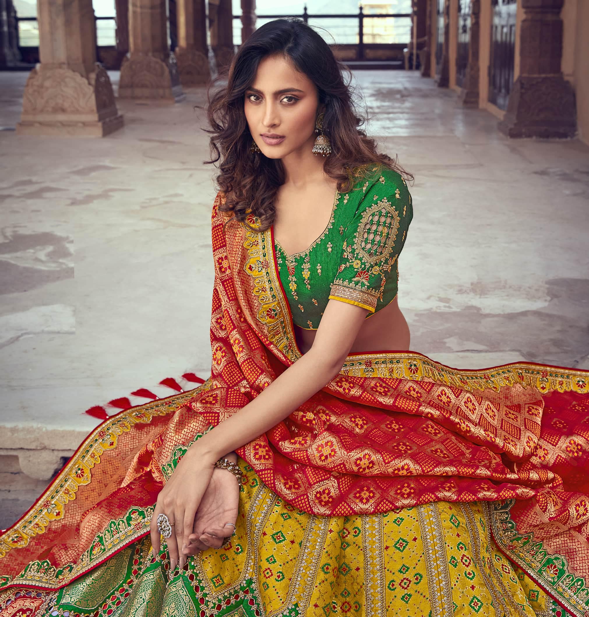 Stunning yellow color net lehenga and parrot green blouse with net dupatta.  Handi crafted Bridal Lehenghas